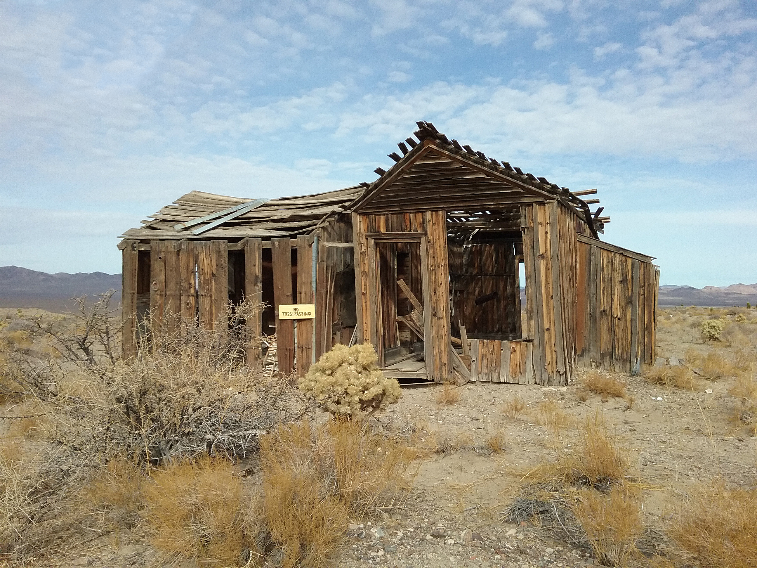 the ruins of a gold-rush era wooden building in a Gold Point, Nevada