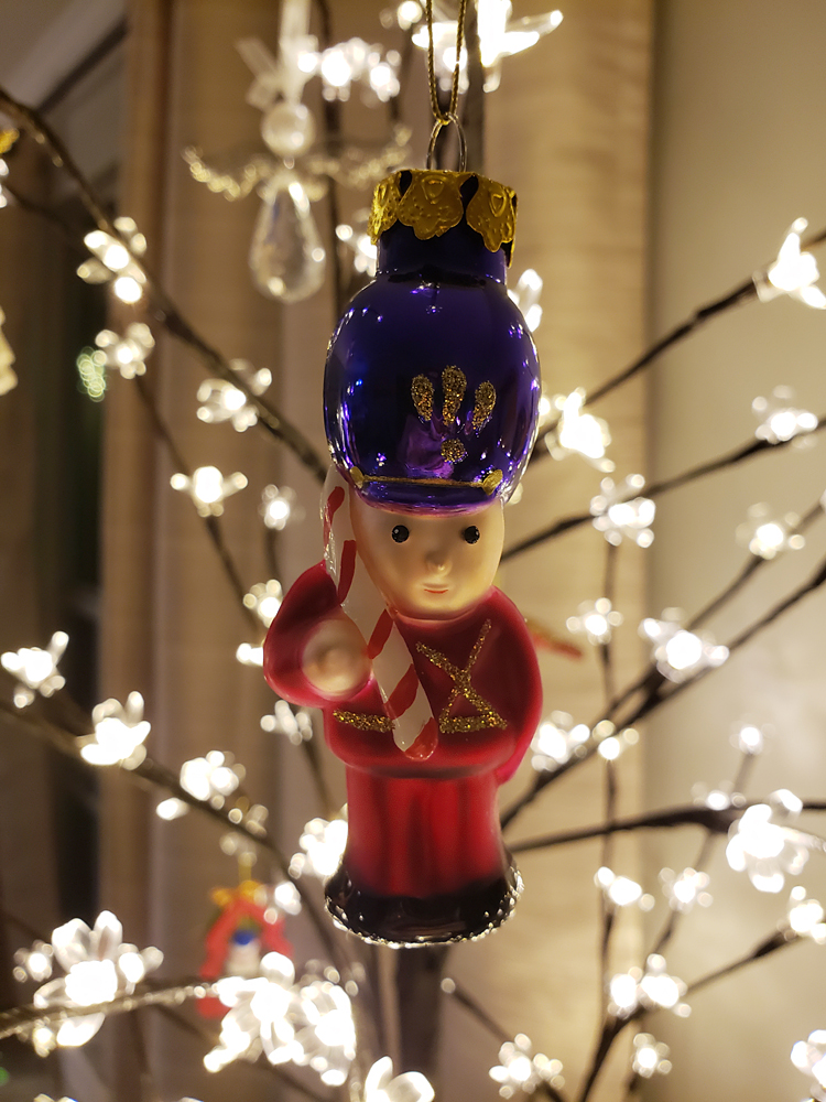 a nutcracker ornament in a Christmas tree