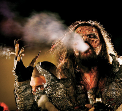 Mr. Lordi blowing cigarette smoke.